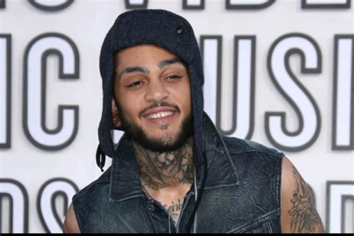Travie McCoy: Girlfriend, net worth, tattoos, smoking & body facts